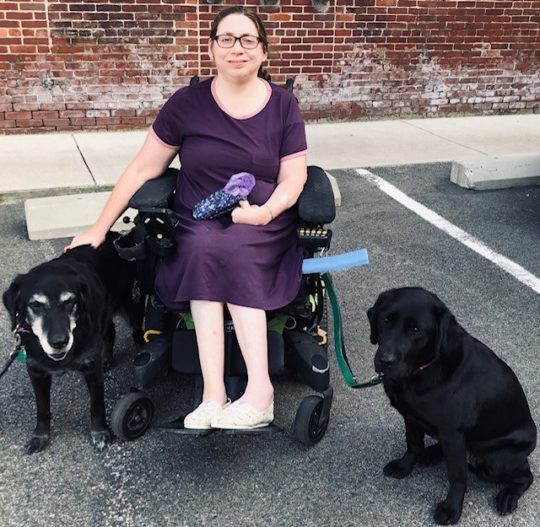 Jen with her retired service dog, Orbit, and new service dog, Spruce
