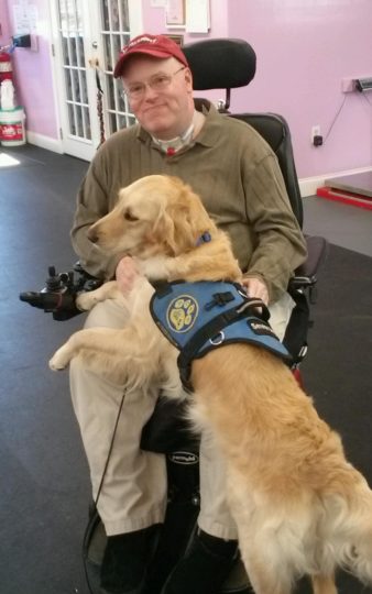 Jeff with his service dog, Aspen.