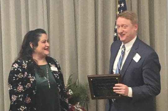 Isadora giving plaque to Senator Feltes