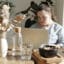 Young woman with Down Syndrome works in her home office.