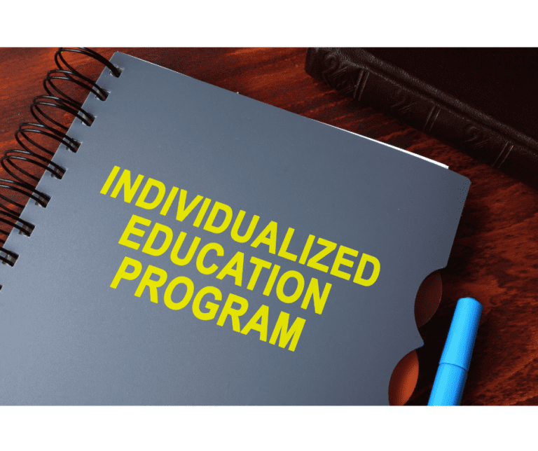 Gray spiral bound notebook with yellow text reading 'Individualized Education Program'.